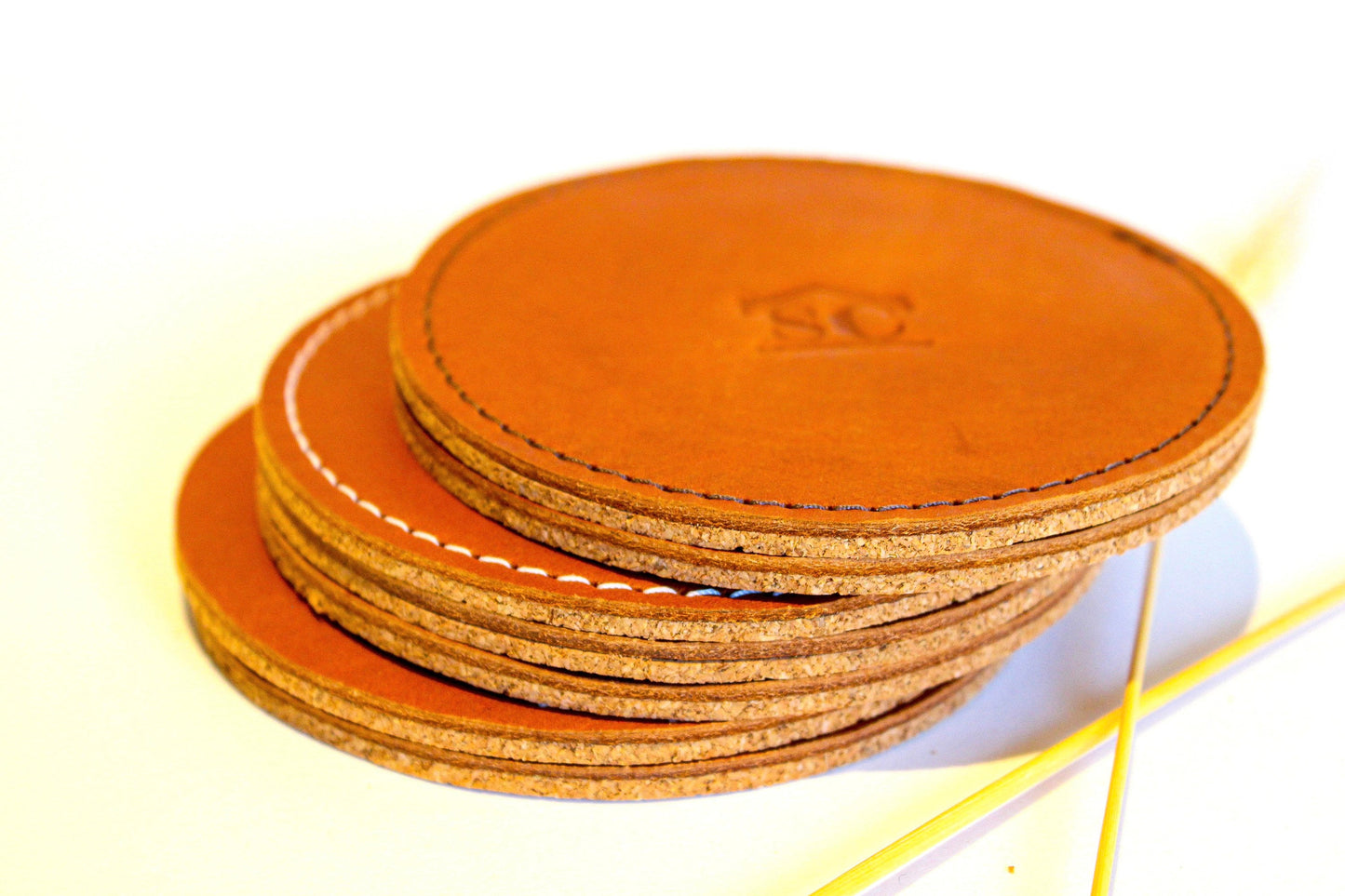 Personalized leather coasters with cork bottom.