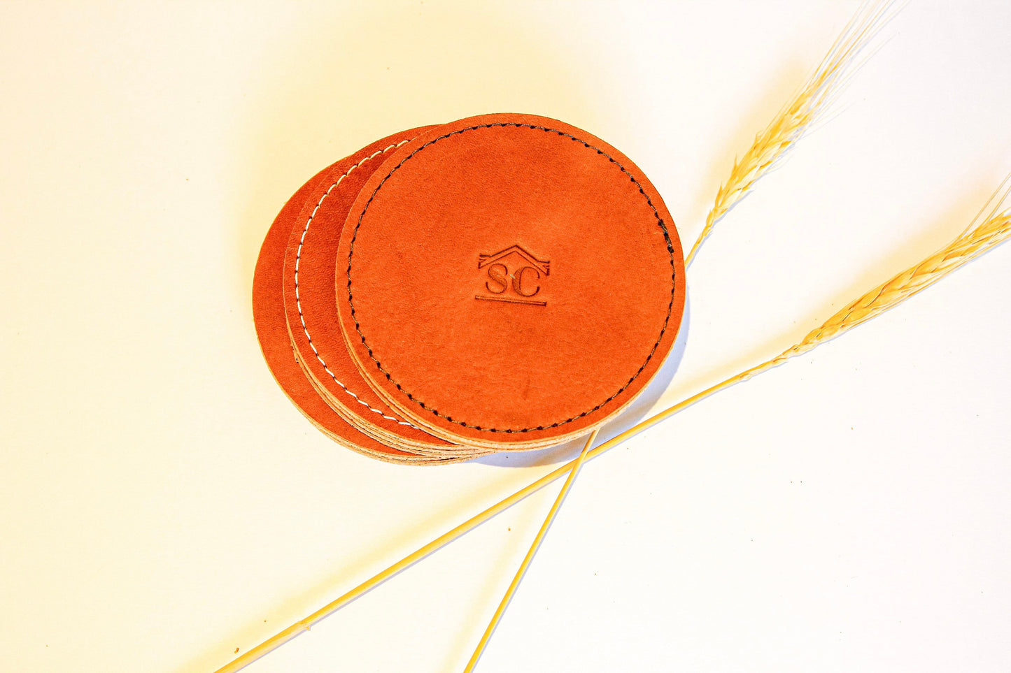 Personalized leather coasters with cork bottom.